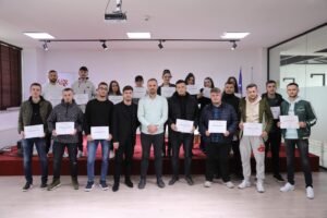 Certificates are distributed to students participating in software development training