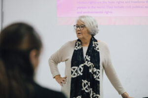 Professor Christina Standerfer gives a lecture to AAB College students